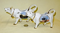 Le Treport and nesting storks souvenir cow creamers